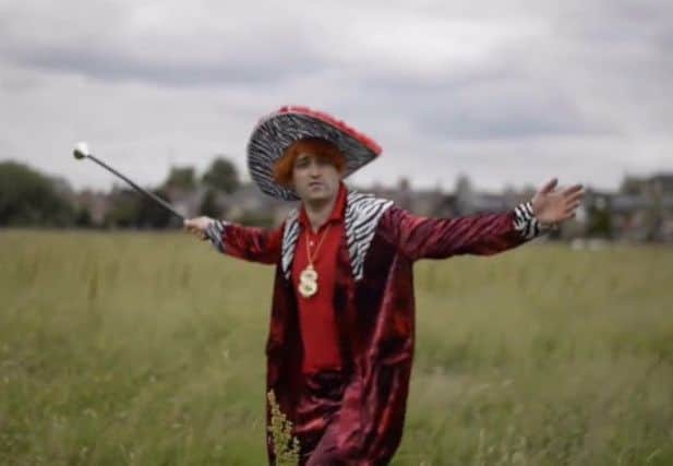 Matt Collins dressed as a pimp in his hilarious rap video