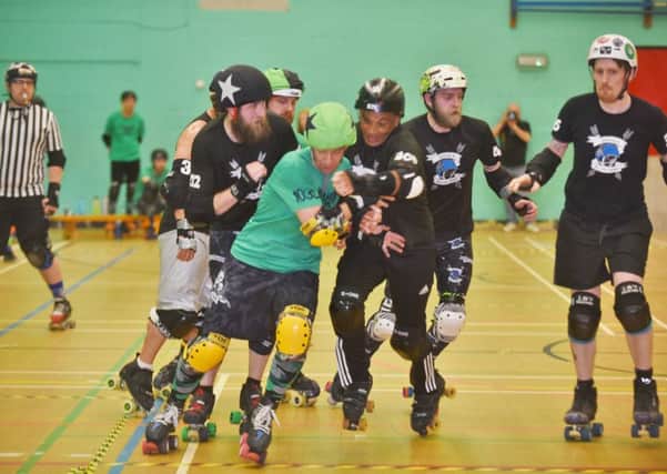 Brawls of Steel (green) in action against Suffolk Rollers. Photo: David Lowndes.