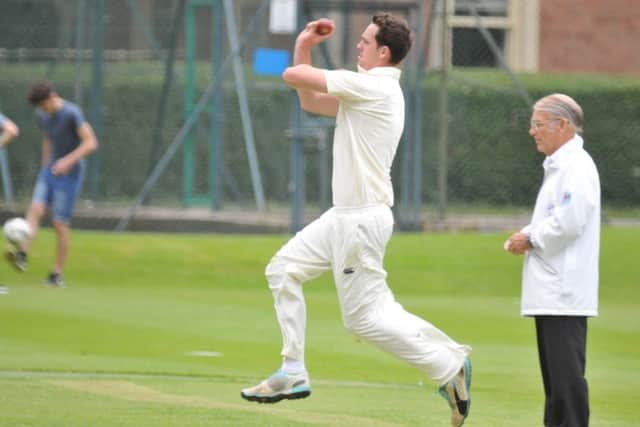 Rob Bentley bowling for Bourne against Boston. Photo: Tim Wilson.