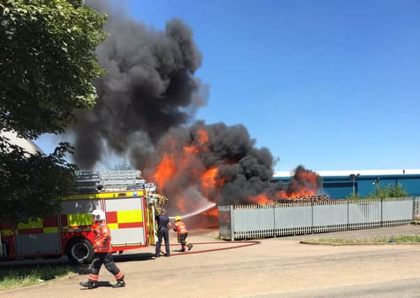 Firefighters tackle the blaze. Pic: Lewis McManus