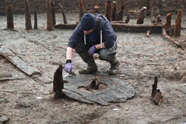 Bronze Age wheel found at Must Farm archaeological dig at Kings Dyke. EMN-160218-132750009