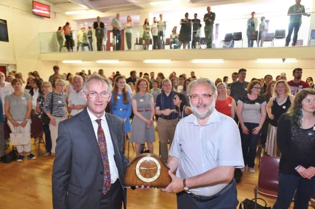 Deputy head at The King's School Trevor Elliott retires after 40 years at the school. He was presented with a clock by Charles Conquest, a former teacher, in front of hundreds of former puils and parents who attended the event EMN-160717-194129009