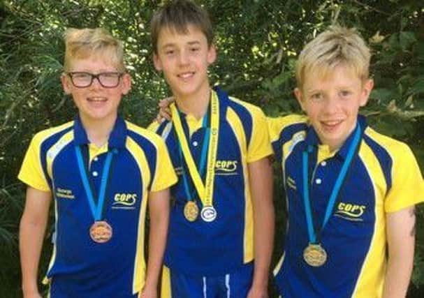 The COPS clean sweep in the U13 800m race courtesy of Connor Walker (gold), James Rothwell (silver) and George Whiteman (bronze).
