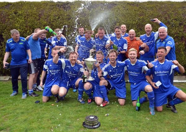 Moulton Harrox celebrate their Peterborough Premier Division title win.