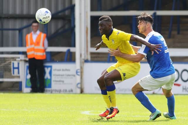 Andrew Hughes of Posh and Hadi Sacko of Leeds. Photo: Joe Dent/theposh.com.