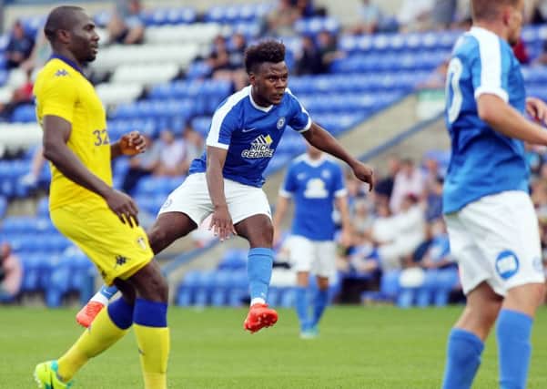 Posh striker Shaquile Coulthirst scores his first goal of the game against Leeds. Photo: Joe Dent/theposh.com.