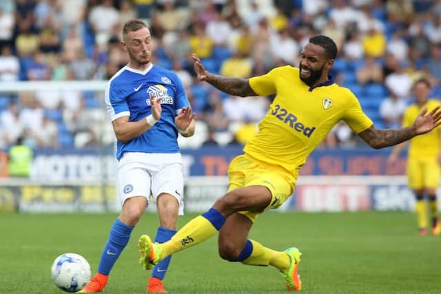 Marcus Maddison in action for Posh against Leeds United's Kyle Bartley. Photo: Joe Dent/theposh.com.