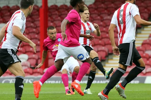 Paul Taylor scores the early Posh goal at Brentford. Photo: Joe Dent/theposh.com.