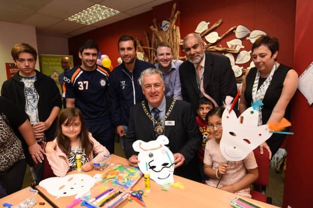 Mayor David Sanders with guests and children at the opening of the Peterborough Literacy Hub in Bridge Street. EMN-160727-120752009