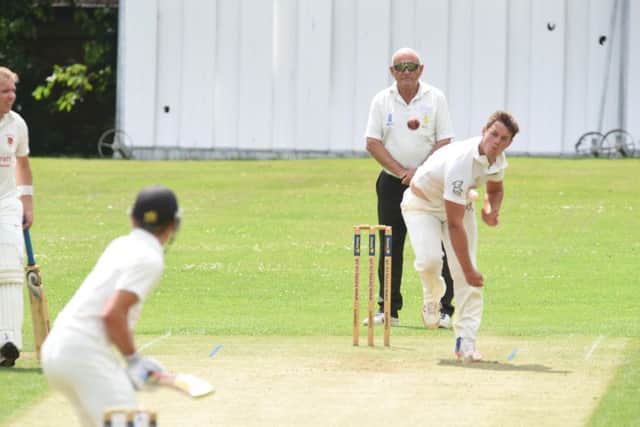 Joe Dawborn bowling for Peterborough Town against Oundle. Photo: David Lowndes.