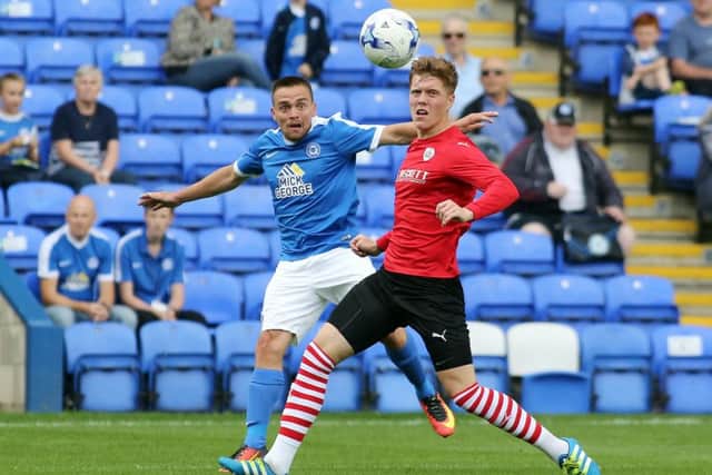 Posh striker Paul Taylor crosses the ball in the 2-0 home defeat by Barnsley. Photo: Joe Dent/theposh.com.