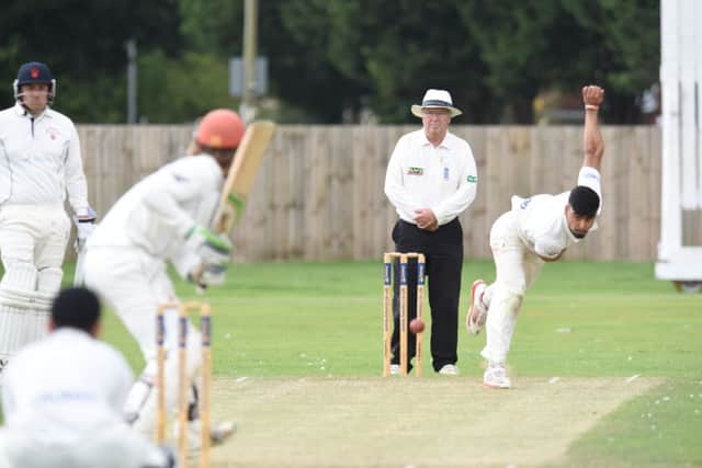 Mohammed Danyaal bowling for Peterborough Town against Horton House. Photo: David Lowndes.