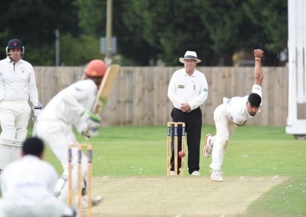 Mohammed Danyaal bowling for Peterborough Town against Horton House. Photo: David Lowndes.