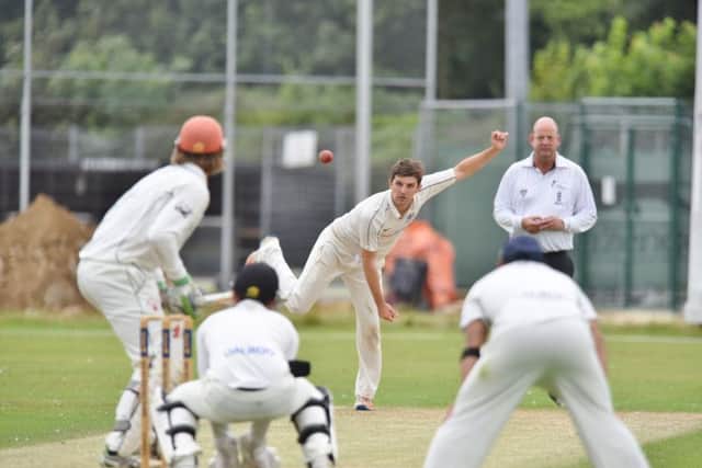 Lewis Bruce bowling for Peterborough Town against Horton House. Photo: David Lowndes.