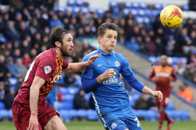 Tom Nichols (right) in action for Posh against Bradford City. Photo: Joe Dent/theposh.com.
