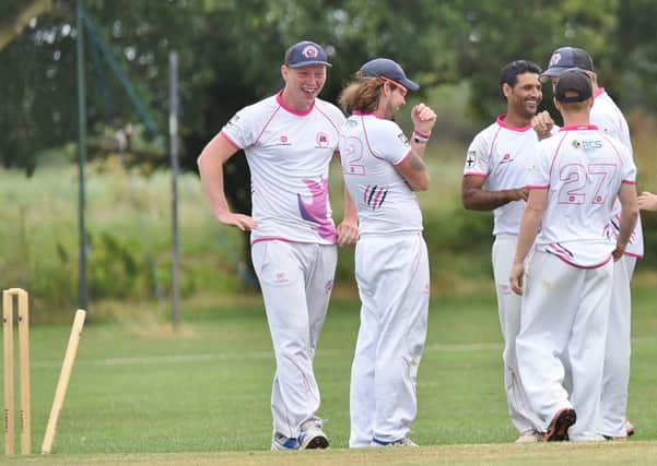 Ketton celebrate a wicket in their 10-wicket success at Newborough. Photo: David Lowndes.