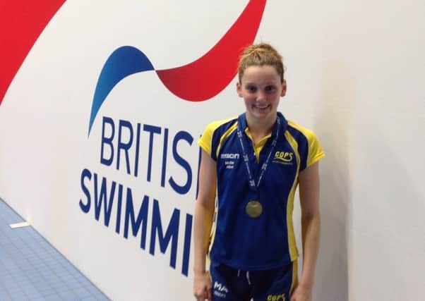 Mollie Allen with her gold medal.