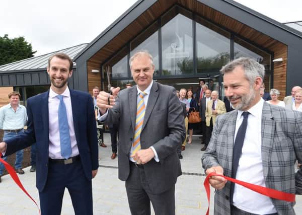 Stewart Jackson MP, centre, opens the Dalmark Groupws extension, with, from left, director Matthew Dalton and Peter Fox MD.    EMN-160718-093210009