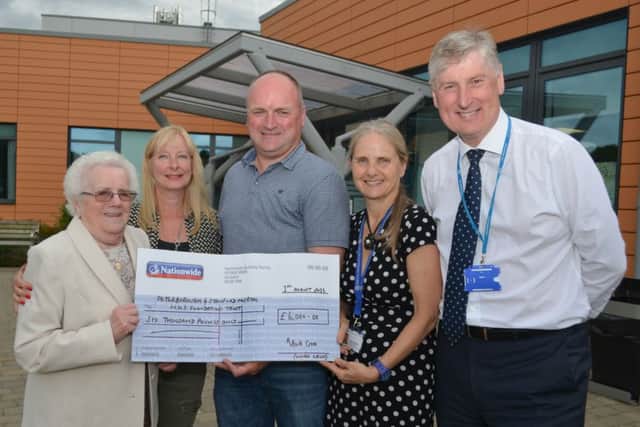 Mark presents the cheque