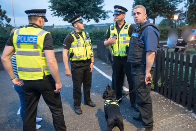 Eric the dog with officers from Northants Police