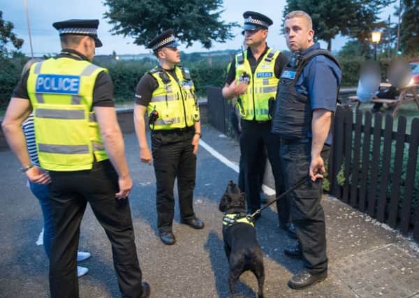 Eric the dog with officers from Northants Police