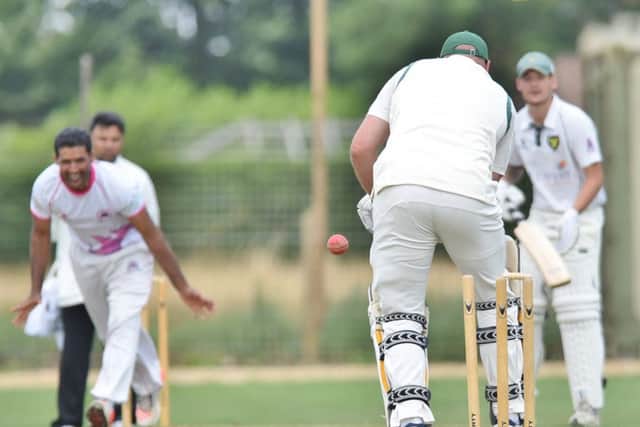 Ketton's Shakir Mahmood bowls Newborough's Dave Stratton. Photo: David Lowndes.
