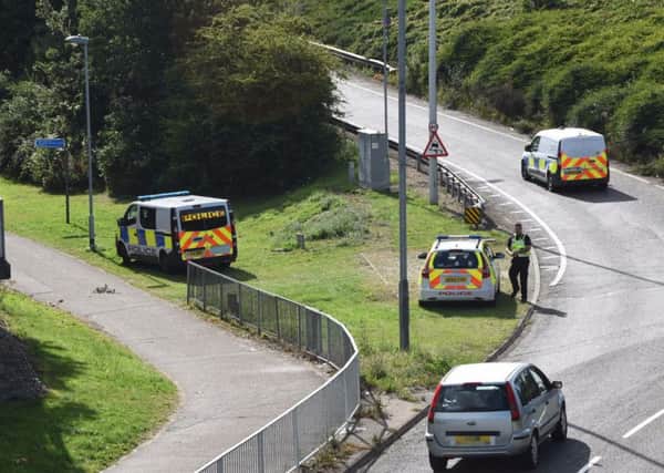 Police attending to the sudden death in Maskew Avenue today - Photo: David Lowndes