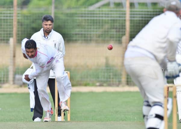 Shakir Mahmood on his way to 7-33 for Ketton against Newborough. Photo: David Lowndes.