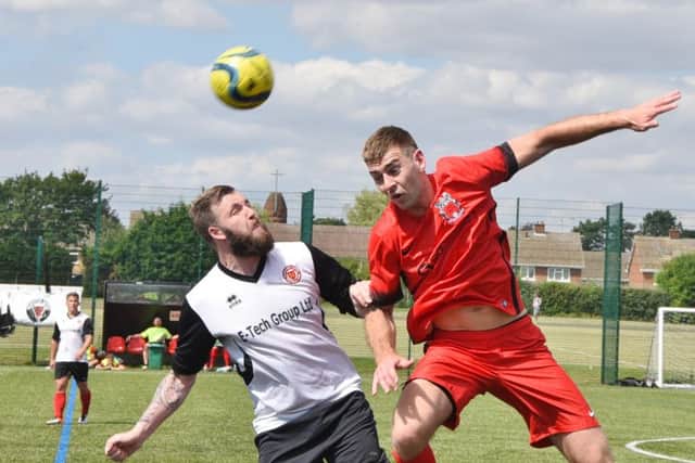 Action from Netherton (white) v Pinchbeck in the Peterborough Premier Division. Lee Clementson is the Netherton player. Photo: David Lowndes.