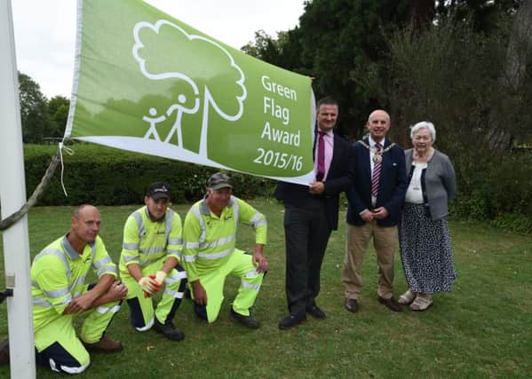Coun Gavin Esey, Coun John Peach, Yvonne Lowndes, chairman of the Friends of Central Park with Ian lilley, Steve Woodruff and Arthur Fisher (park rangers) with their new Green Flag EMN-150816-170026009