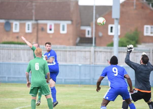 Josh Moreman heads Peterborough Sports' first goal against Gorleston. Photo: David Lowndes.