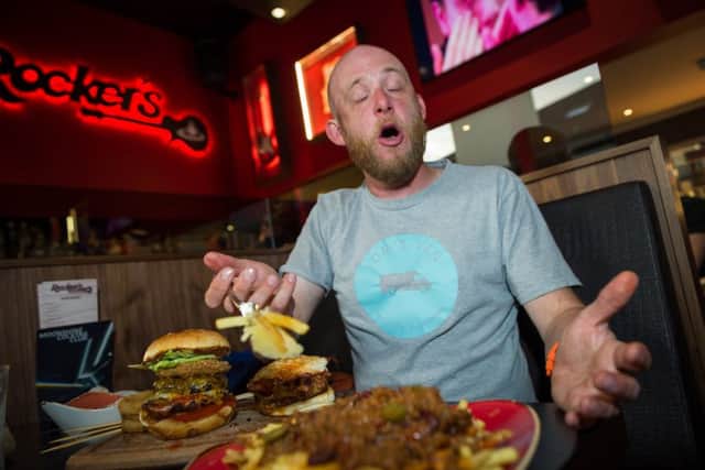 Rob Radcliffe age 36 takes on the hot burger challenge at Rocker's Stake House in Cambridge.