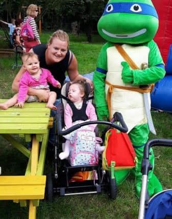 Sky Disson, with daughters Lillie and Evie
