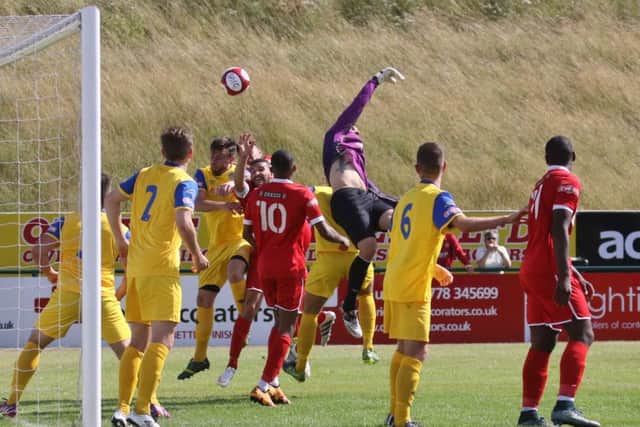 Action from Stamford AFC's (red) win over Spalding United in the Lincs Senior Trophy. Photo: Geoff Atton.