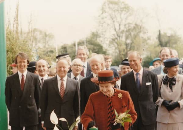 Kenneth (third from left, red tie) with the Queen and Prince Philip in May 1988 at the opening of the then head office of Norwich and Peterborough Building Society