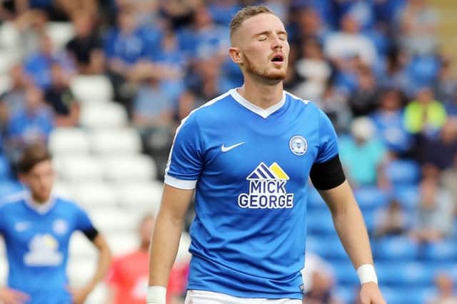 Posh star Marcus Maddison cuts a dejected figure at the end of the game with Bradford City. Photo: Joe Dent/theposh.com.
