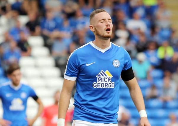 Posh star Marcus Maddison cuts a dejected figure at the end of the game with Bradford City. Photo: Joe Dent/theposh.com.
