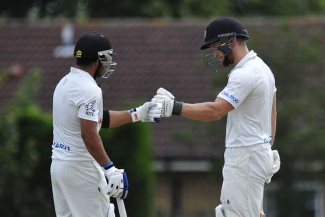 Peterborough Town's batting stars Asim Butt (left) and Alex Mitchell during their second-wicket stand of 72 against Rushden. Photo: Chris Lowndes.