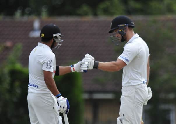 Peterborough Town's batting stars Asim Butt (left) and Alex Mitchell during their second-wicket stand of 72 against Rushden. Photo: Chris Lowndes.