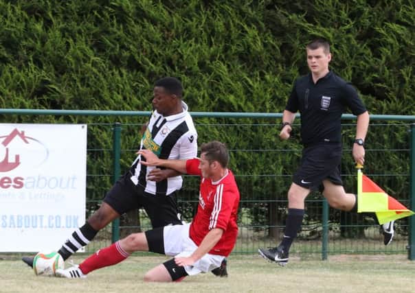 Jezz Goldson-Williams (stripes) in action for Peterborough Northern Star against Rothwell Corinthians. Photo: Tim Gates.