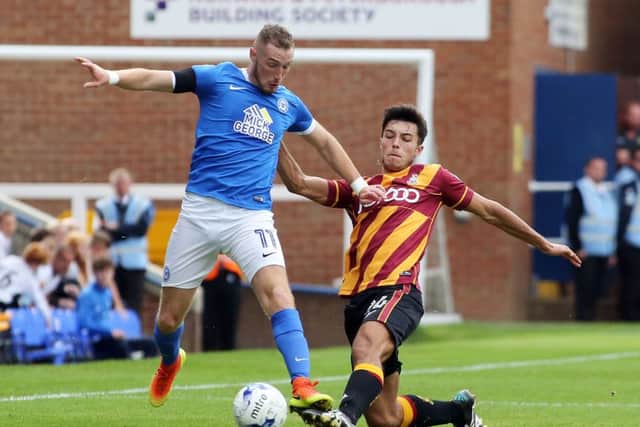 Marcus Maddison of Peterborough United in action with Bradford City's Daniel Devine - Mandatory by-line: Joe Dent / Peterborough United Football Club Ltd / PaperPix- 2016 - 16/17 - FOOTBALL - ABAX Stadium - Peterborough, Cambs - Peterborough United v Bradford City