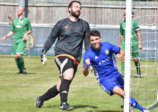 Dan Clements celebrates an FA Cup goal for Peterborough Sports against Gorleston earlier this month. Photo: David Lowndes.