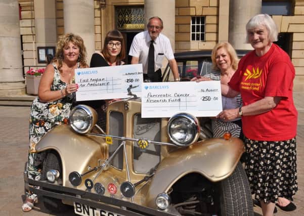Peterborough classic and vintage cars event organisers Paula Thacker and Ray Dobbs with Coun Janet Goodwin presenting cheques to Leanne Tyers from EAAA and Doreen Dare from Pancreatic Cancer Research EMN-160817-003314009