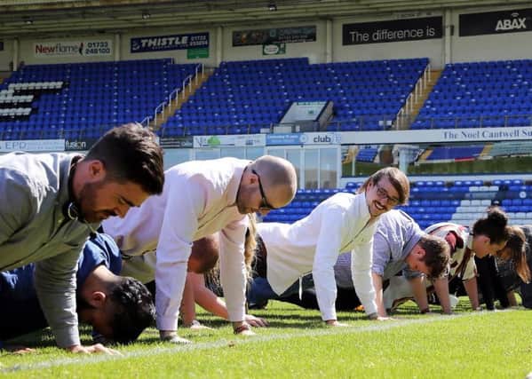 ABAX staff taking part in the 22 Push-Up Challenge