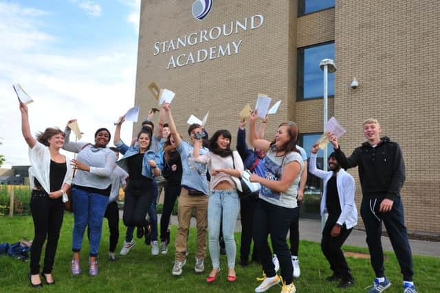 Students of Stanground Academy celebrating sucess in the A level results EMN-140814-123150001