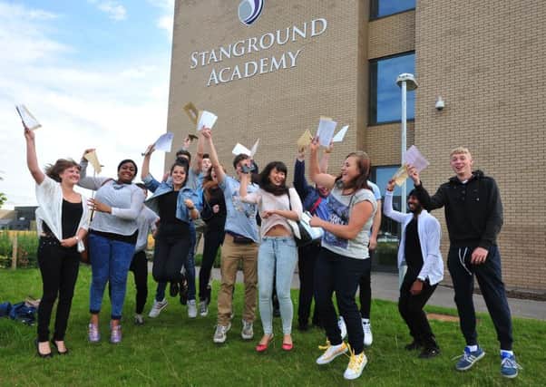 Students of Stanground Academy celebrating sucess in the A level results EMN-140814-123150001