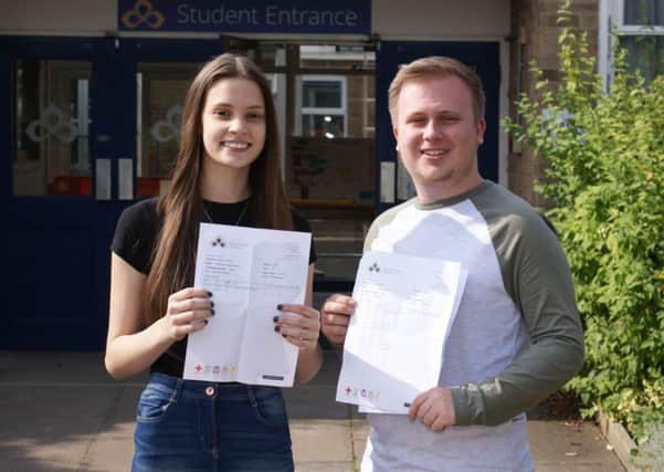 Bethany Davies and Adam Mulley celebrate their fantastic A Level results at Sawtry Village Academy