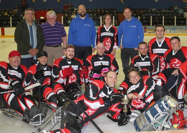 The Peterborough Phantoms sledge hockey team celebrate their British Championship win.