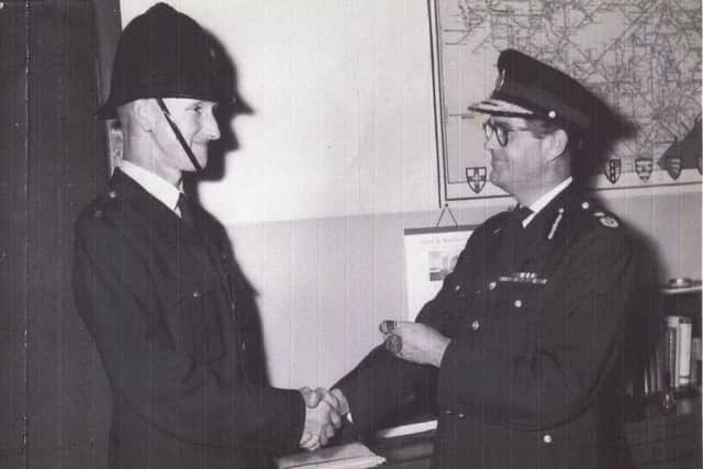 Verdun Buck being presented with his original medal