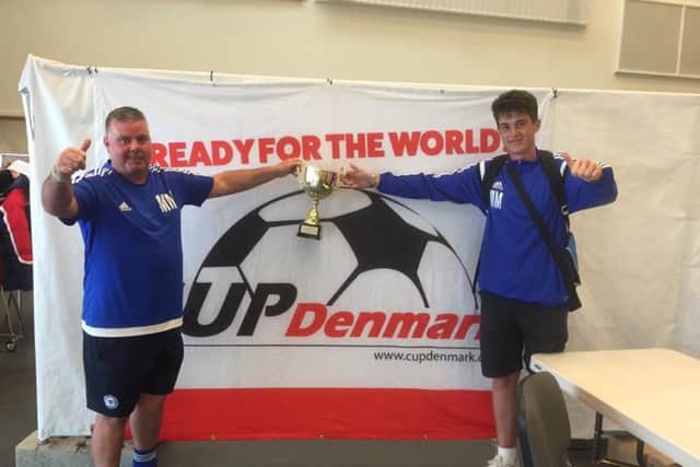 Mark (left) and Jake Morling celebrate with the Copenhagen Cup.